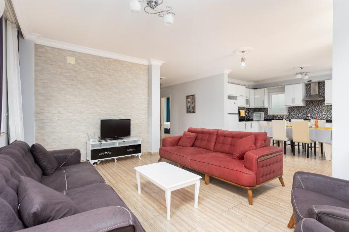 Open-plan living room with sofas, dining area, kitchen, A/C, WiFi internet, and satellite TV . - Villa Magnolia . (Photo Gallery) }}