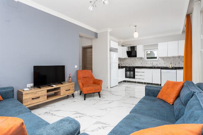 Open-plan living room with sofas, kitchen, A/C, WiFi internet, and satellite TV . - Villa Mazoya . (Photo Gallery) }}