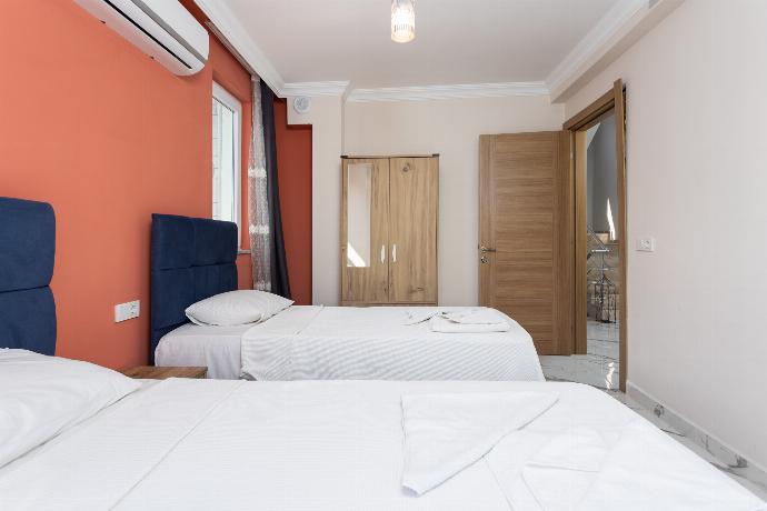 Twin bedroom with A/C . - Villa Mazoya . (Photo Gallery) }}