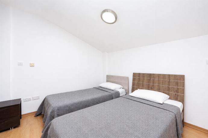 An interior view of a third bedroom, located in a charming loft or attic space with unique architectural angles. . - Villa Olympia . (Galleria fotografica) }}