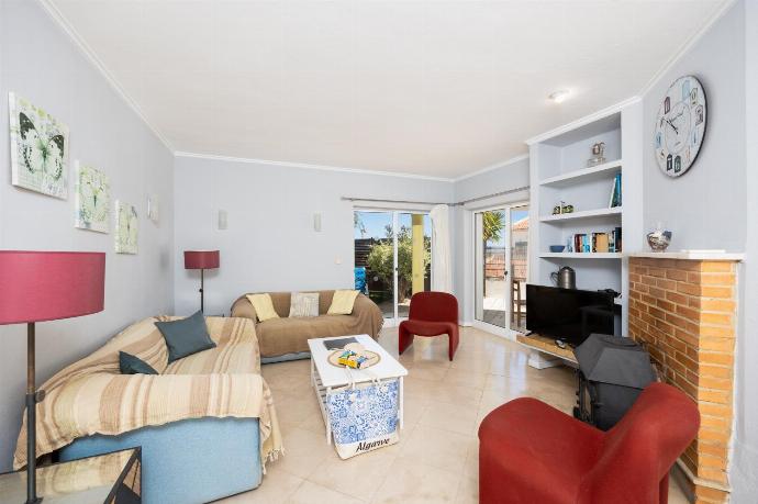 ,Living room with sofas, dining area, ornamental fireplace, WiFi internet, and satellite TV . - Villa Brejos . (Fotogalerie) }}