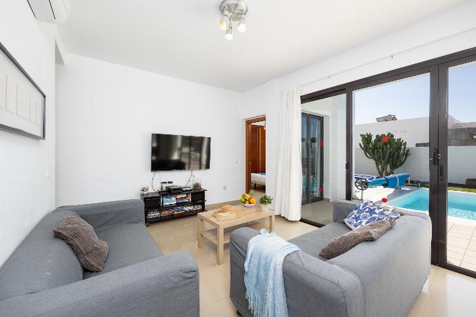 Living room with sofas, dining area, A/C, WiFi internet, and satellite TV . - Villa Aurora . (Photo Gallery) }}