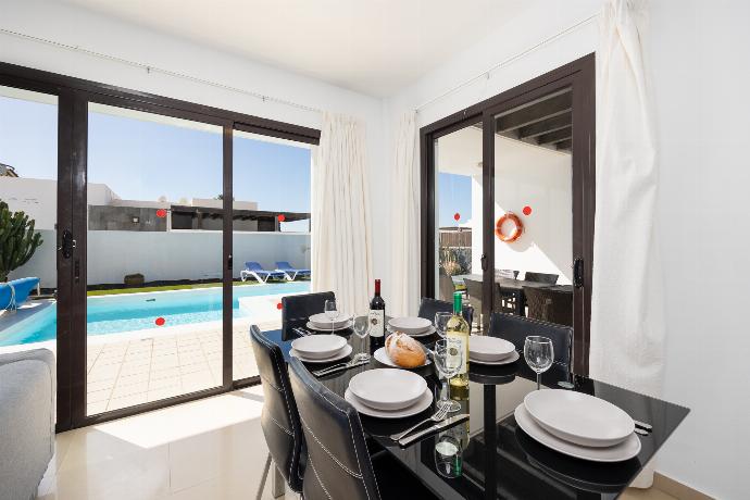 Living room with sofas, dining area, A/C, WiFi internet, and satellite TV . - Villa Aurora . (Photo Gallery) }}