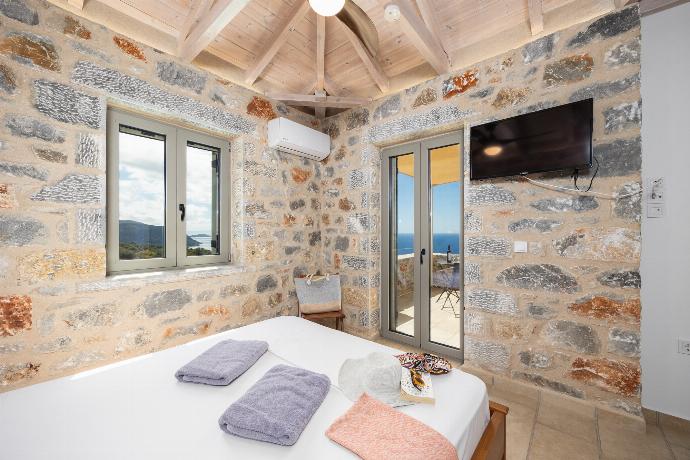 Double bedroom with A/C . - Villa Dioni Ena . (Photo Gallery) }}