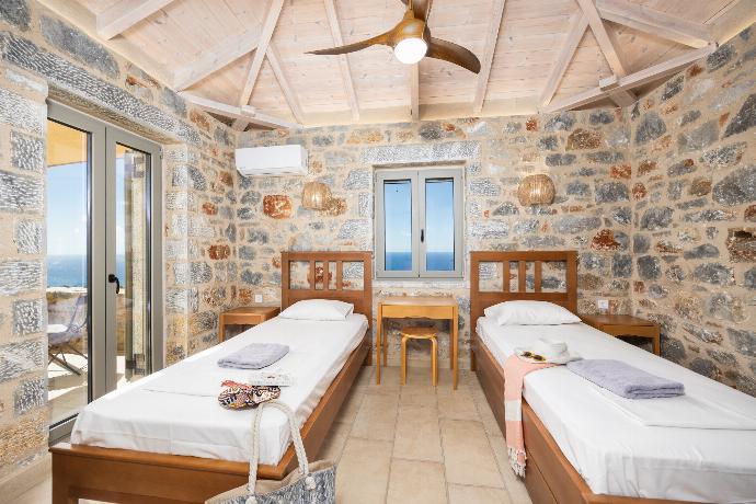 Twin bedroom with A/C . - Villa Dioni Ena . (Photo Gallery) }}