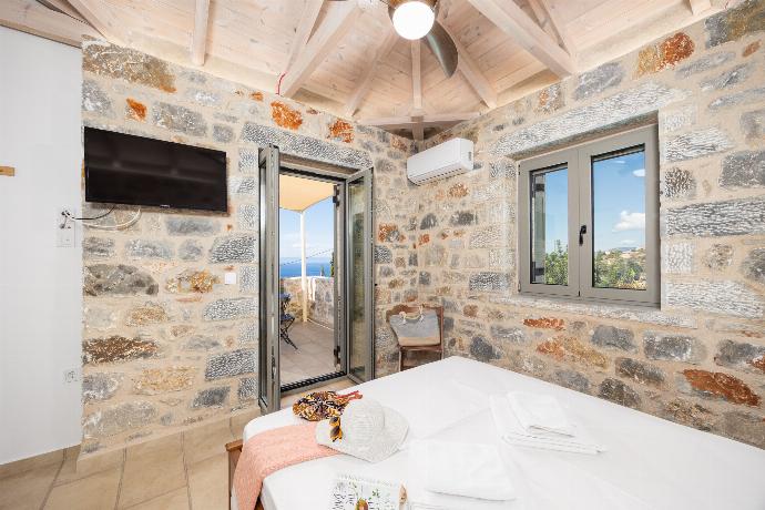 Double bedroom with A/C . - Villa Dioni Tria . (Photo Gallery) }}