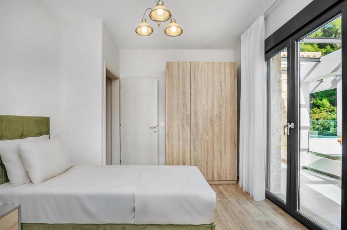 Double bedroom with A/C . - Epta Villas Thio . (Photo Gallery) }}