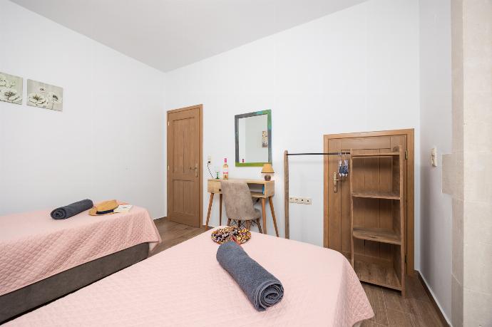Twin bedroom with en suite bathroom and A/C . - Villa Koupos . (Photo Gallery) }}