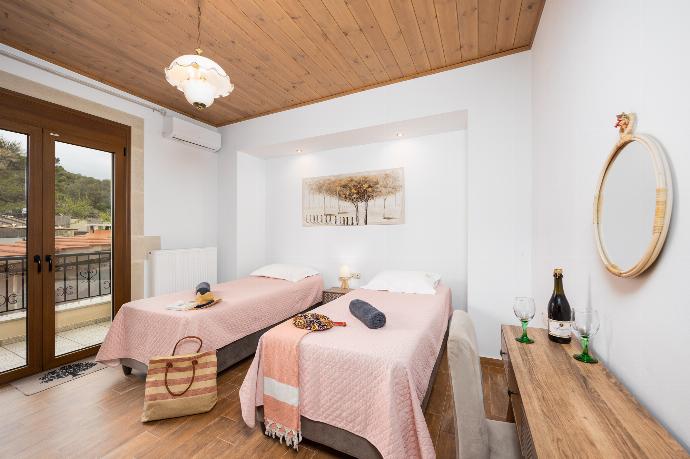 Twin bedroom with A/C . - Villa Koupos . (Photo Gallery) }}
