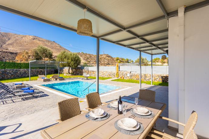 Open-plan living room with sofa, dining area, kitchen, A/C, WiFi internet, and satellite TV . - Villa Livis 1 . (Photo Gallery) }}