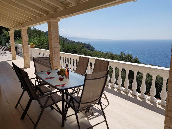 Upper terrace area with panoramic sea views . - Villa Theodora . (Photo Gallery) }}