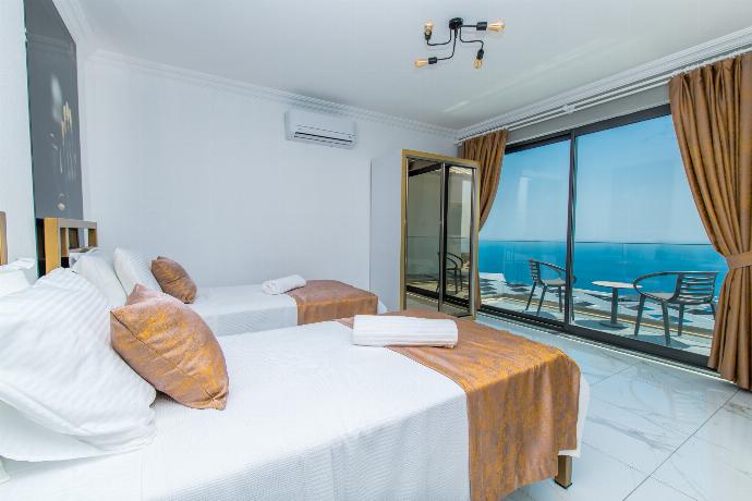 Twin bedroom with A/C, and upper terrace access with panoramic sea views . - Villa Mulberry 2 . (Photo Gallery) }}