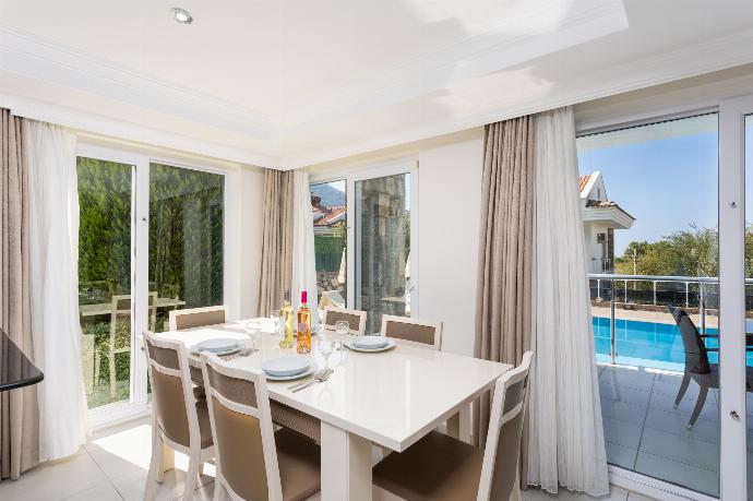 Open-plan living room with sofas, dining area, kitchen, ornamental fireplace, A/C, WiFi internet, and satellite TV . - Golden Heights 5 . (Photo Gallery) }}