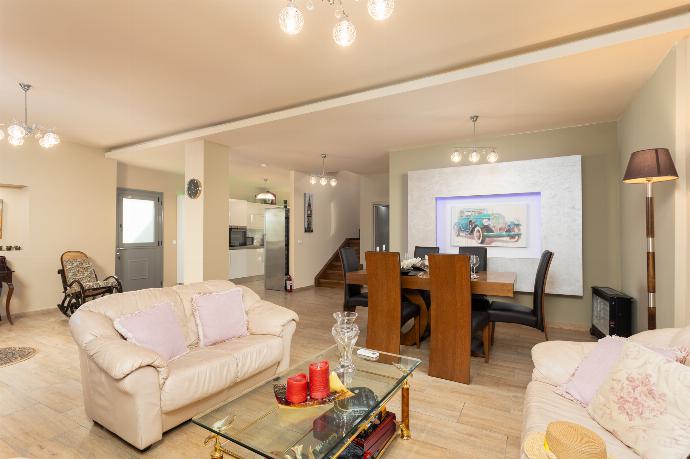 Open-plan living room with sofas, dining area, kitchen, A/C, and WiFi internet . - Villa Ammos . (Photo Gallery) }}