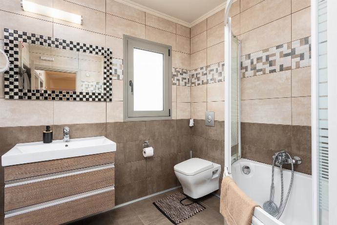 Family bathroom with bath and shower . - Villa Ammos . (Photo Gallery) }}