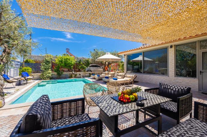 Sheltered terrace area . - Villa Ammos . (Photo Gallery) }}