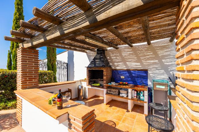 Sheltered terrace area with BBQ . - Villa Los Espejos De Frigiliana . (Photo Gallery) }}