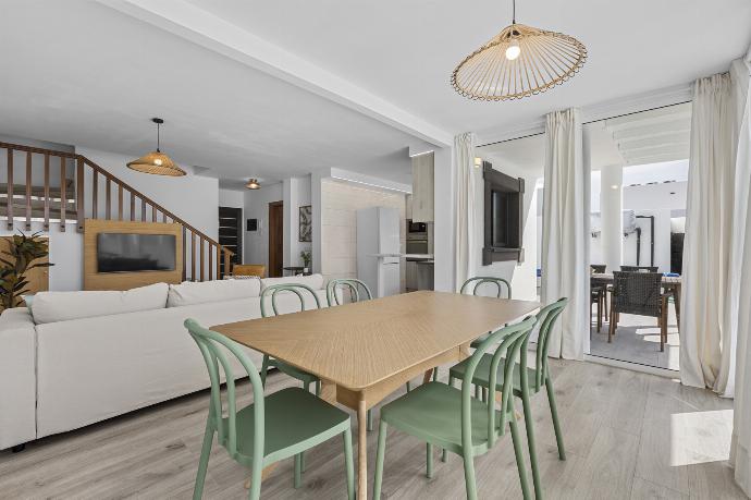 Open-plan living room with sofa, dining area, kitchen, WiFi internet, satellite TV, and sea views . - Villa Oscar . (Photo Gallery) }}