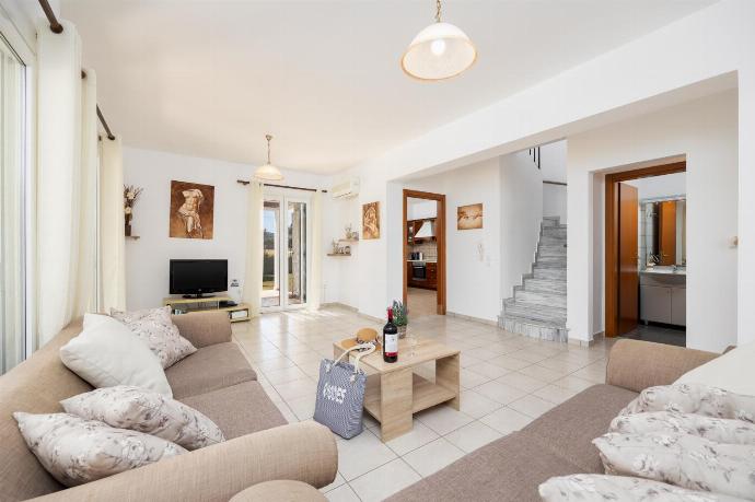 Living room with sofas, A/C, WiFi internet, and satellite TV . - Villa Afrodite Classico . (Photo Gallery) }}