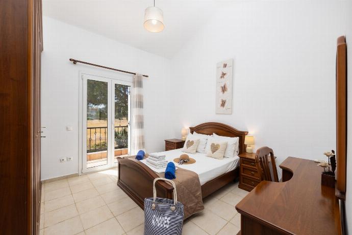 Double bedroom with A/C . - Villa Afrodite Classico . (Photo Gallery) }}