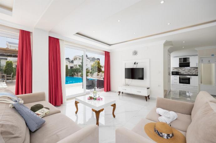 Living room with sofas, dining area, A/C, WiFi internet, and satellite TV . - Villa Premium F . (Photo Gallery) }}