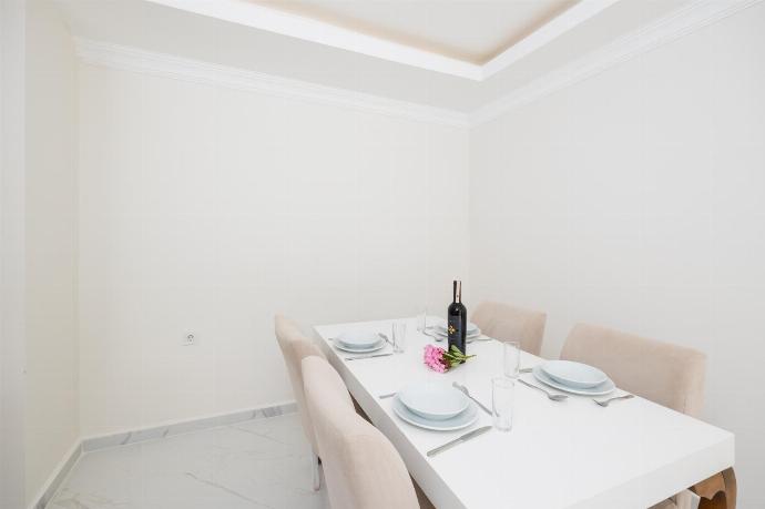 Living room with sofas, dining area, A/C, WiFi internet, and satellite TV . - Villa Premium F . (Photo Gallery) }}