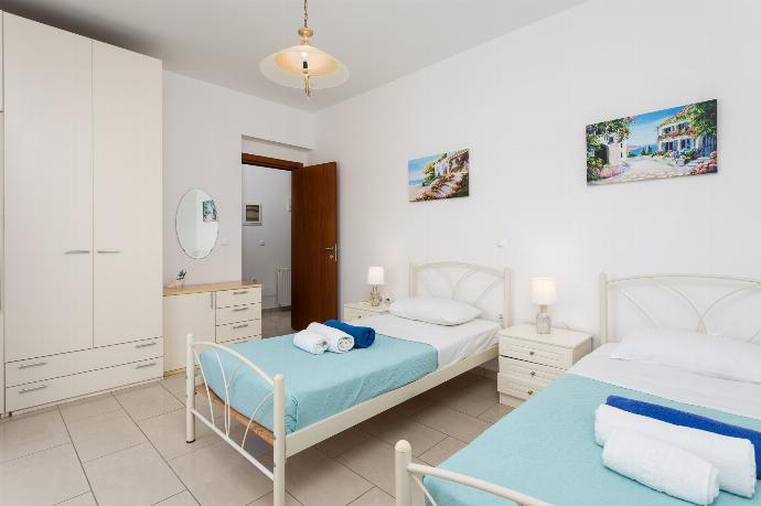 Twin bedroom with A/C and balcony access . - Amphitrite Villa . (Photo Gallery) }}