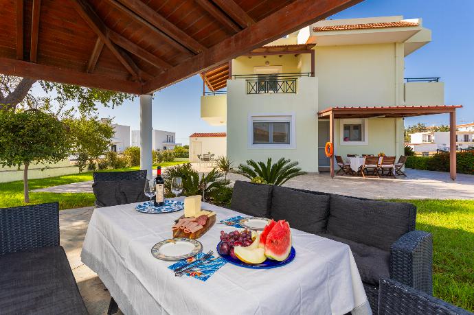 Sheltered terrace area . - Amphitrite Villa . (Photo Gallery) }}