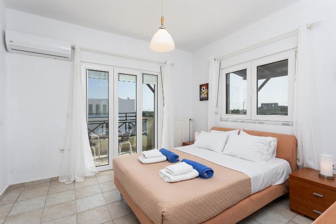 Double bedroom with en suite bathroom, A/C, and balcony access . - Hermione Villa . (Photo Gallery) }}