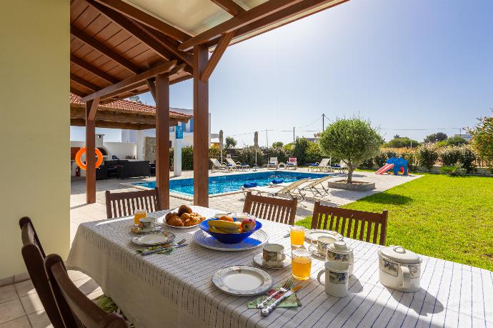 Sheltered terrace area . - Hermione Villa . (Photo Gallery) }}