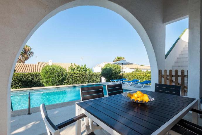 Sheltered patio with dinning area . - Villa Binibels . (Photo Gallery) }}