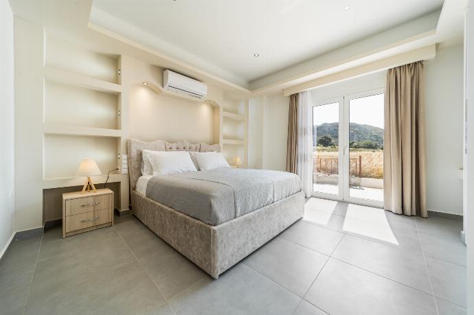 Double bedroom with A/C, en suite and upper terrace access with panoramic views . - Villa Rudi . (Photo Gallery) }}