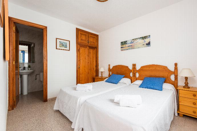 Twin bedroom with ensuite bathroom . - Villa Catalina . (Photo Gallery) }}