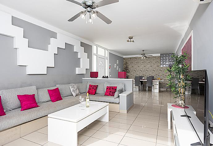 Living room with sofa, dining area, A/C, WiFi internet, satellite TV, and sea views . - Casa Marina . (Photo Gallery) }}