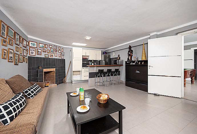 Living room with sofa, kitchen, and ornamental fireplace . - Casa Marina . (Photo Gallery) }}