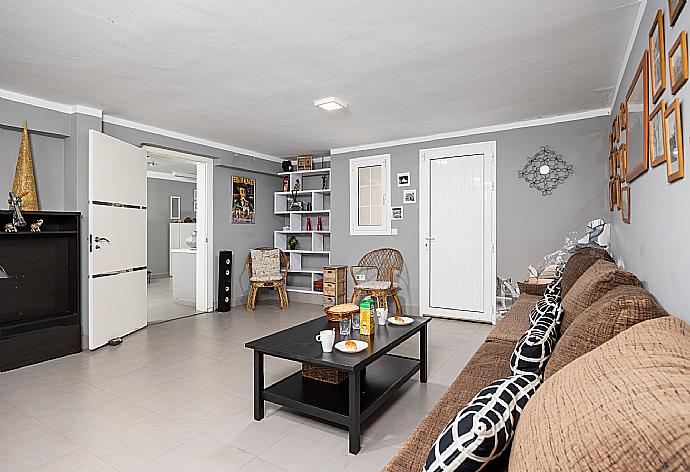 Living room with sofa, kitchen, and ornamental fireplace . - Casa Marina . (Photo Gallery) }}