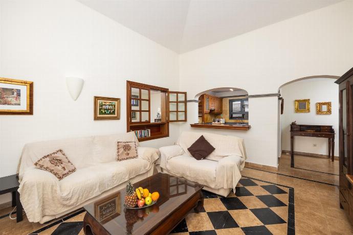 Living room with sofas, WiFi internet, and satellite TV . - Villa Capricho . (Photo Gallery) }}