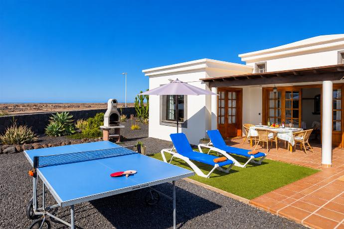 Terrace area with table tennis . - Villa Capricho . (Photo Gallery) }}