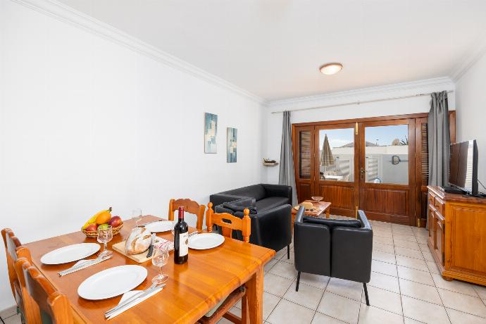 Living room with sofa, dining area, A/C, WiFi internet, and satellite TV . - Villa Florencia . (Photo Gallery) }}