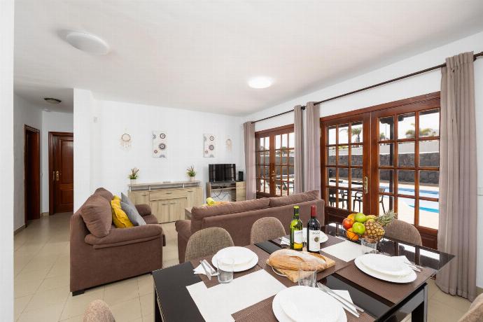Living room with sofas, dining area, WiFi internet, and satellite TV . - Villa Salar . (Photo Gallery) }}