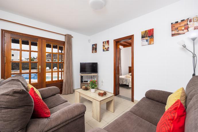 Living room with sofas, dining area, WiFi internet, and TV . - Villa Blanca . (Photo Gallery) }}