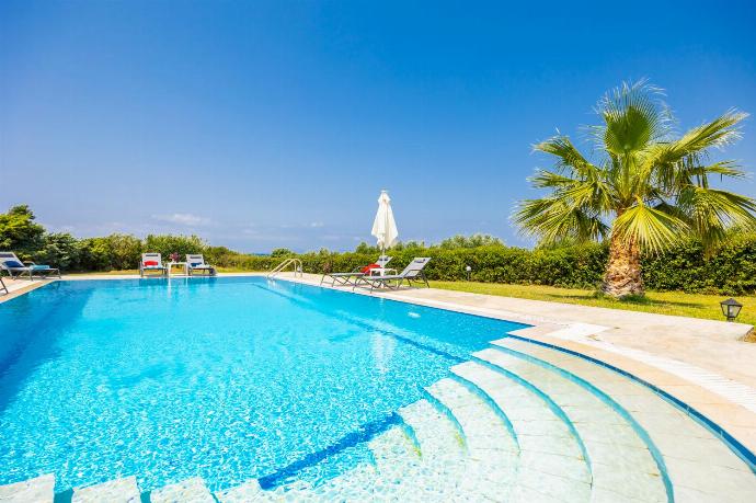 Private pool, terrace, and garden with sea views . - Villa Sunset . (Photo Gallery) }}