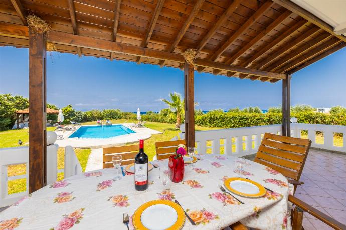 Sheltered terrace area . - Villa Sunset . (Photo Gallery) }}