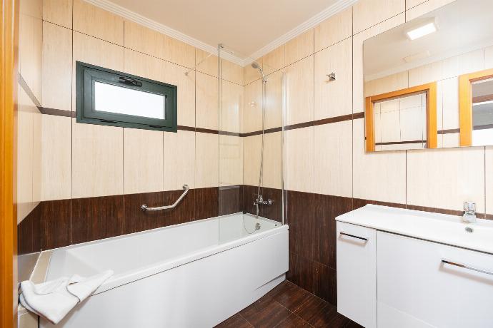 En suite bathroom with bath and shower . - Villa Dacil . (Photo Gallery) }}
