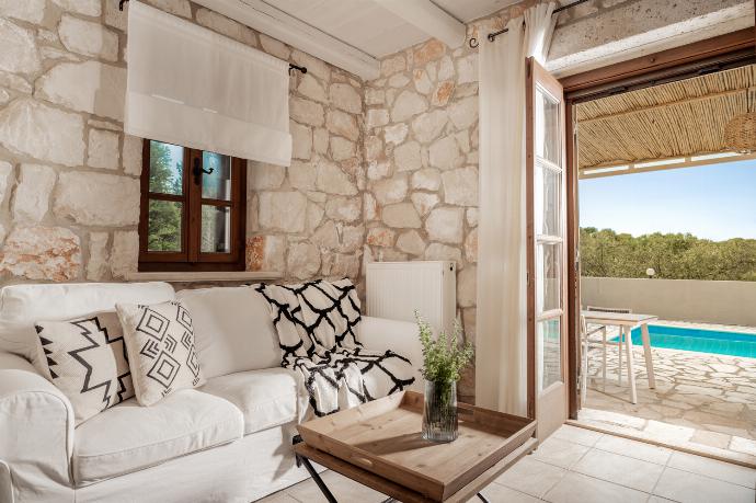Open plan living room with dining area, comfortable sofas, TV, WiFi, patio doors with pool access . - Villa Boscheto Tria . (Photo Gallery) }}