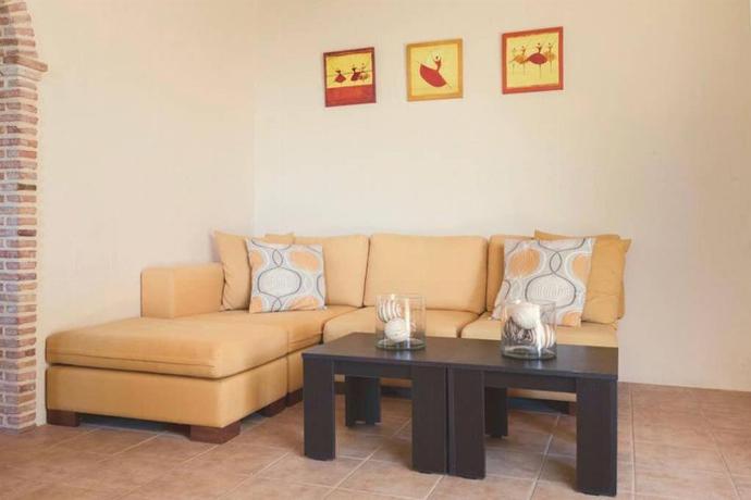 Open plan living room with ornamental fireplace, TV, WiFi, comfortable sofas . - Villa Aloni . (Photo Gallery) }}