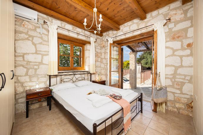 Double bedroom with A/C . - Villa Aloni . (Photo Gallery) }}