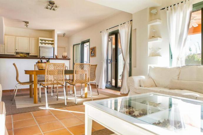 Open plan living room with comfortable sofas, dining area, patio doors, TV, WiFi . - Villa Ionian Rose . (Галерея фотографий) }}