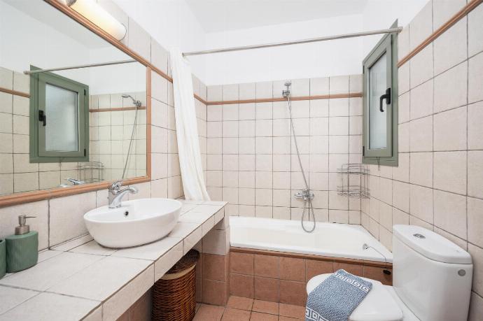 En suite bathroom with bath and shower . - Villa Ionian Rose . (Photo Gallery) }}