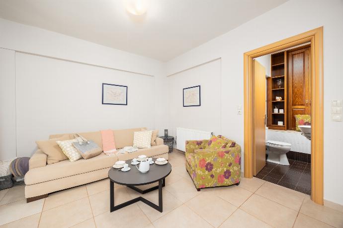 Open-plan living room with sofa, dining area, kitchen, A/C, WiFi internet, and satellite TV . - Villa Nora . (Photo Gallery) }}